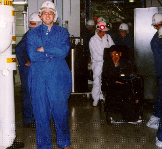 Figure: Neubauer in a rather unflattering clean room suit with the late Sir Stephen Hawking in the SNO detector cavern in 2000